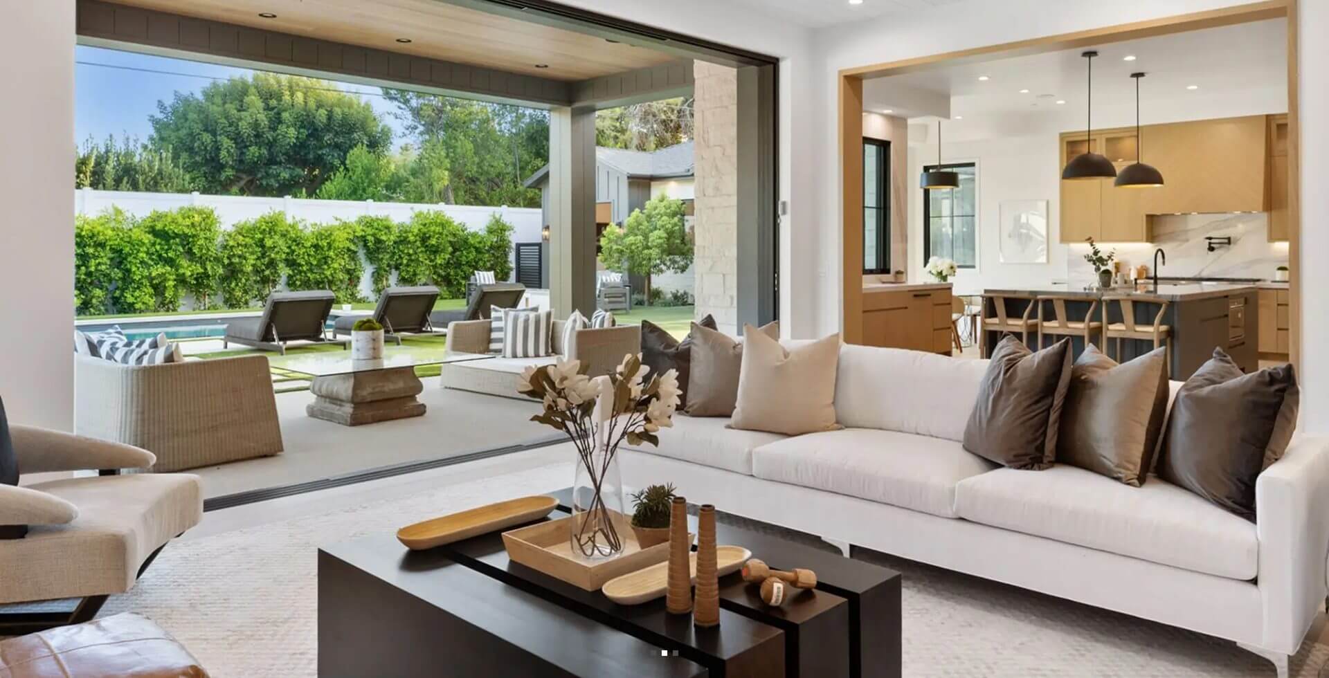 Modern open-concept living room with patio view.